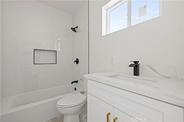 full bathroom featuring toilet, bathtub / shower combination, and vanity