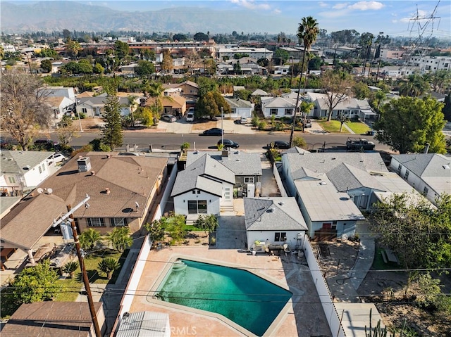 birds eye view of property with a mountain view