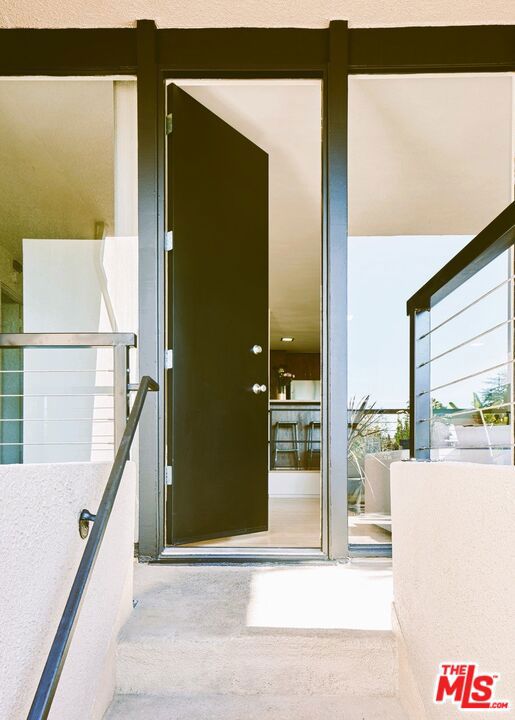 entrance to property with a balcony