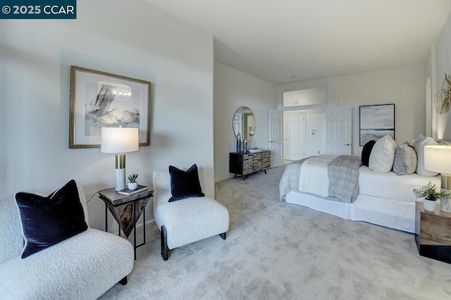 bedroom featuring light colored carpet