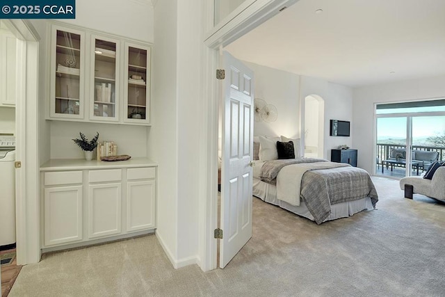 bedroom featuring light colored carpet and access to outside