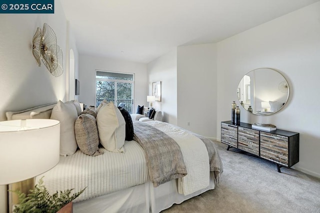 bedroom with light colored carpet