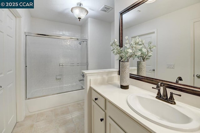 bathroom featuring vanity and enclosed tub / shower combo