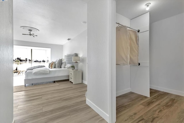 bedroom with light wood-type flooring