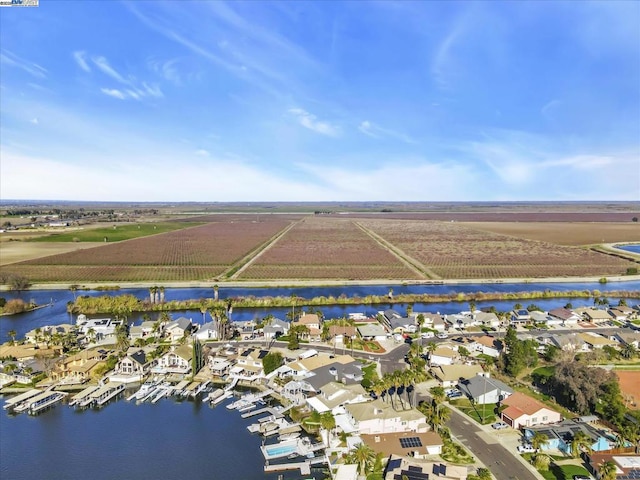 aerial view with a rural view and a water view