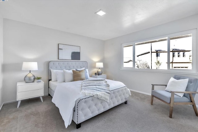 bedroom with light colored carpet