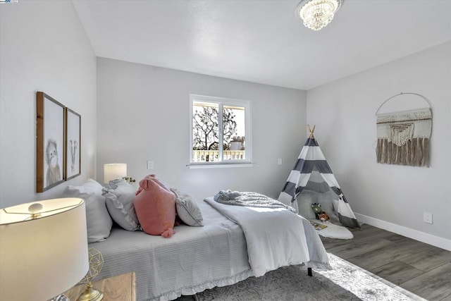 bedroom featuring hardwood / wood-style flooring