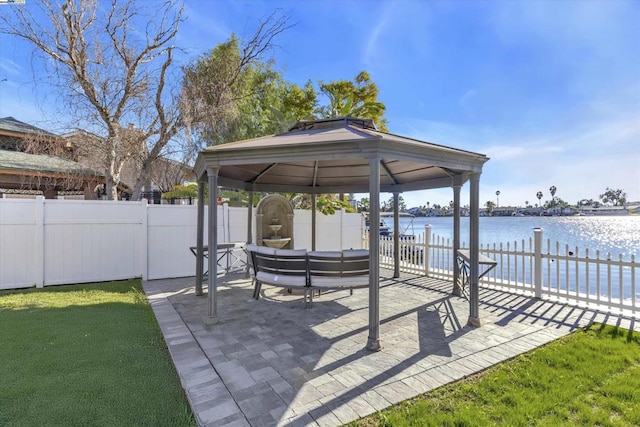 view of patio featuring a gazebo, an outdoor hangout area, and a water view