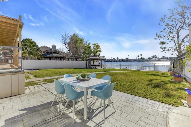 view of patio / terrace with a gazebo and a water view