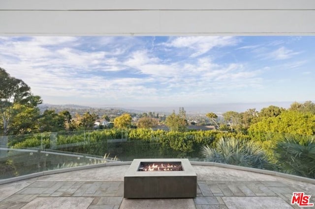 view of patio with an outdoor fire pit