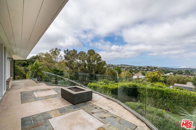 view of patio / terrace with an outdoor fire pit