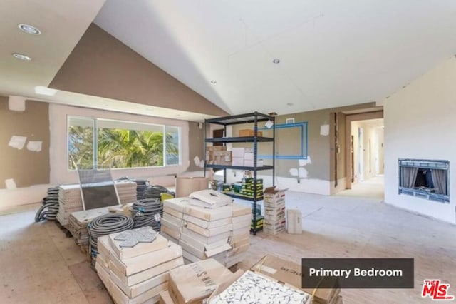 living room featuring lofted ceiling