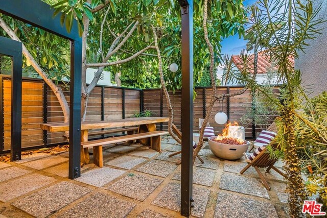 view of patio featuring a fire pit