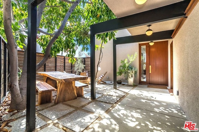 doorway to property featuring a patio