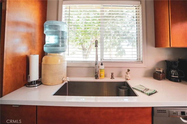 kitchen featuring dishwasher, a healthy amount of sunlight, and sink