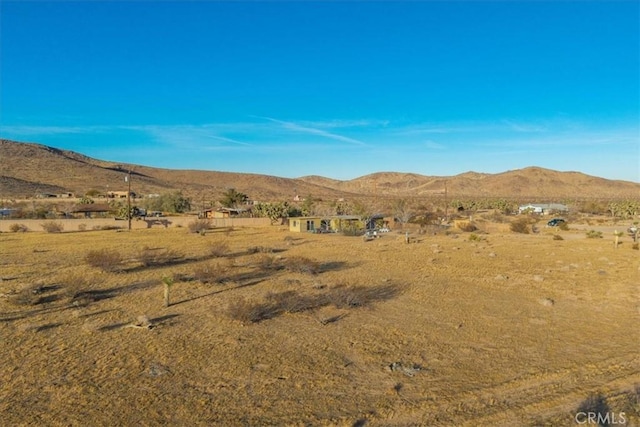 mountain view featuring a rural view