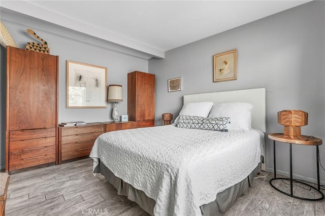 bedroom featuring light wood-style floors