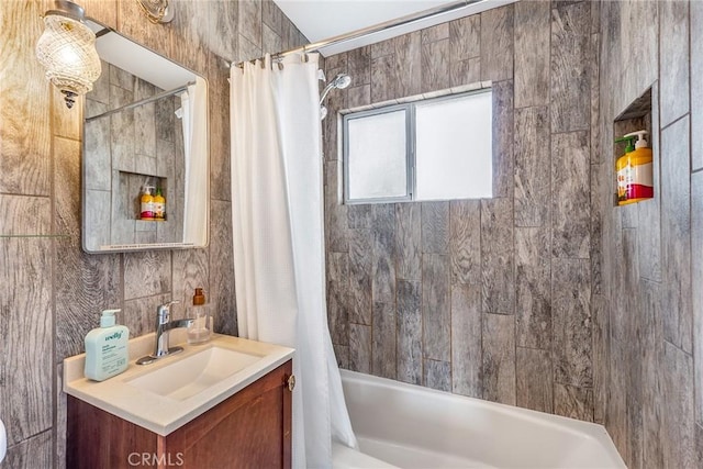 bathroom with shower / tub combo and vanity