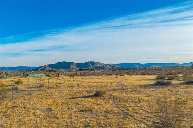 mountain view featuring a rural view