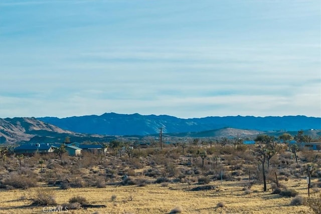 view of mountain feature with a rural view