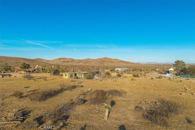 mountain view featuring a rural view