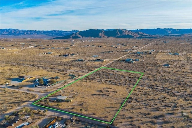 birds eye view of property featuring a mountain view