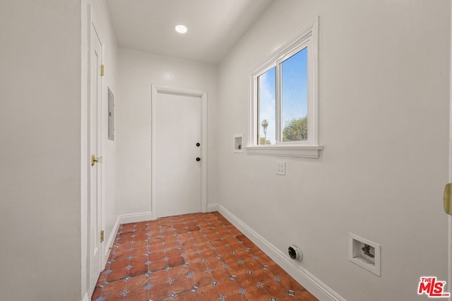 laundry room with electric panel and hookup for a washing machine