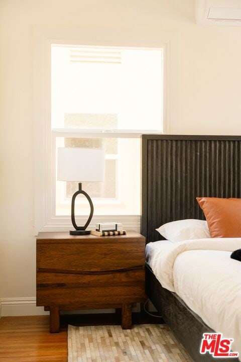 bedroom with light wood-type flooring