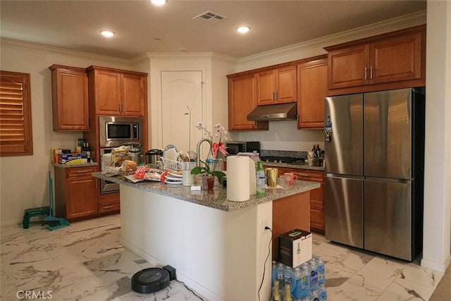 kitchen featuring an island with sink, appliances with stainless steel finishes, dark stone countertops, and crown molding