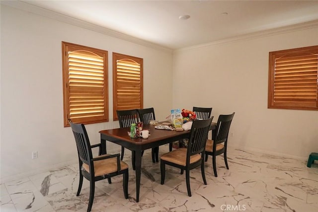 dining area featuring crown molding