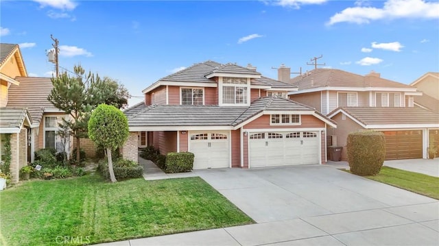 front of property with a garage and a front yard