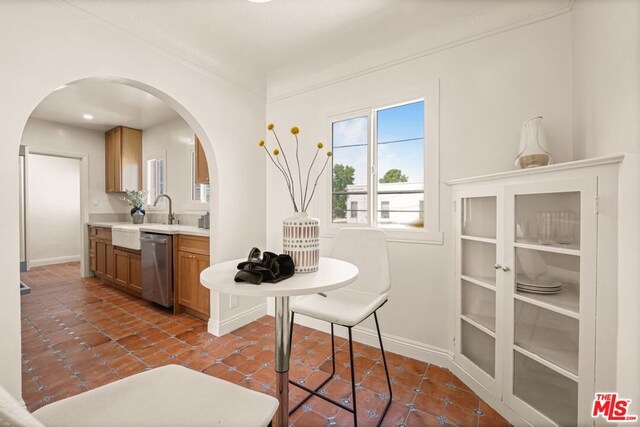 interior space with sink and dark tile patterned floors