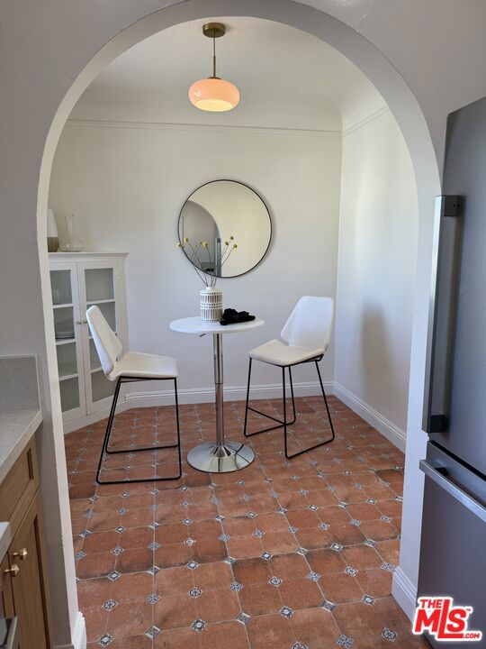 dining room with dark tile patterned flooring