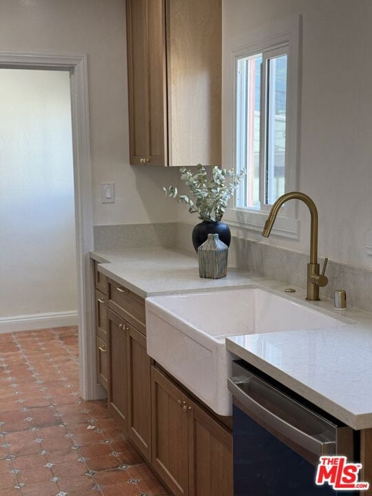 kitchen with stainless steel dishwasher and sink