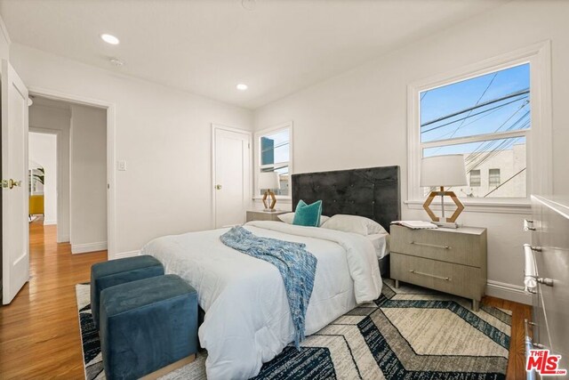 bedroom with light hardwood / wood-style flooring