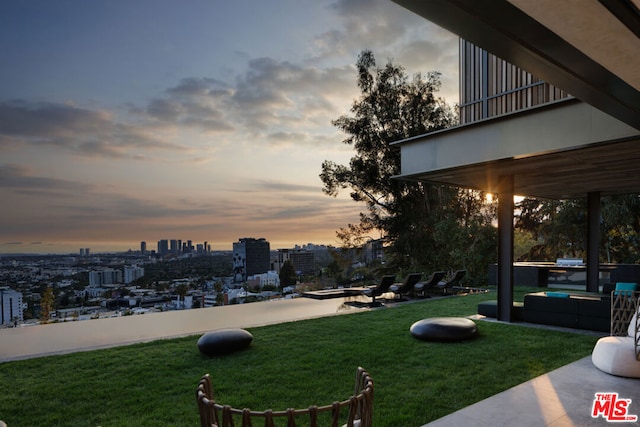 view of yard at dusk