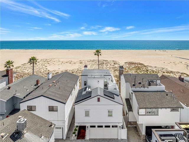 drone / aerial view with a view of the beach and a water view