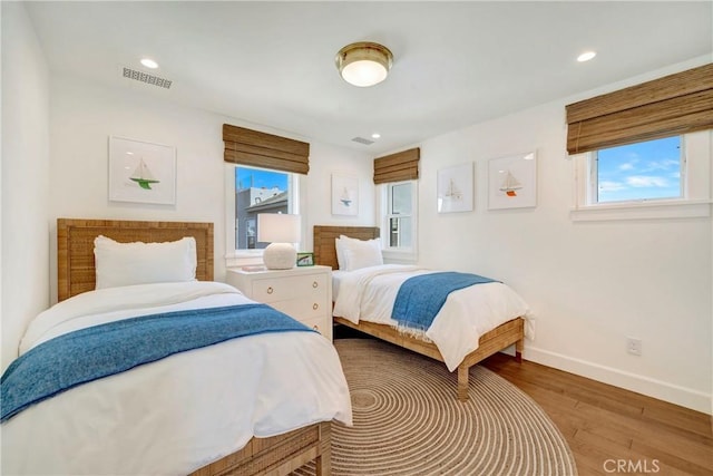 bedroom with hardwood / wood-style flooring