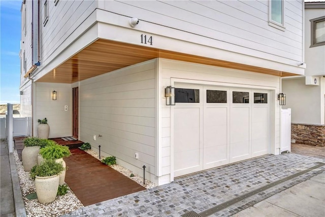 view of side of home featuring a garage