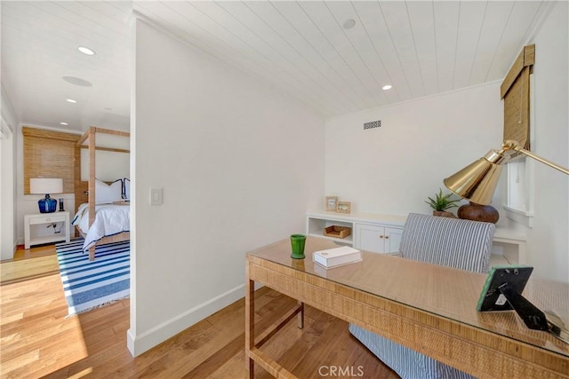 office space with wood ceiling and light hardwood / wood-style flooring