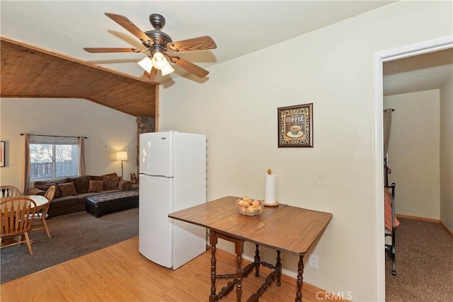 interior space featuring ceiling fan, lofted ceiling, white fridge, light hardwood / wood-style floors, and wooden ceiling