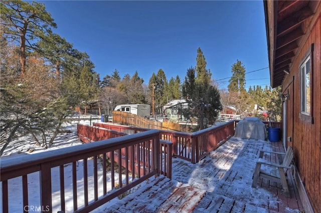 snow covered deck with area for grilling