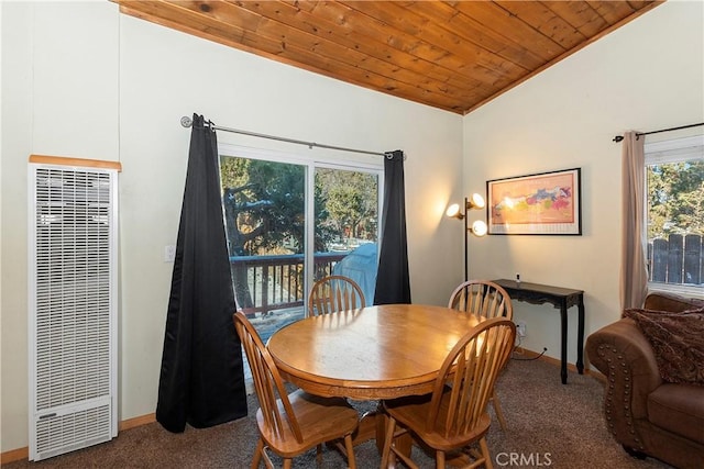 carpeted dining room featuring a healthy amount of sunlight, wood ceiling, and vaulted ceiling