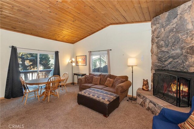 living room with carpet floors, vaulted ceiling, a fireplace, and wooden ceiling