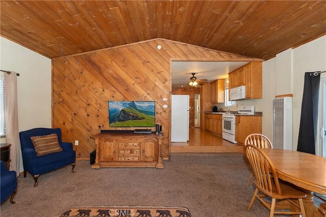 interior space featuring light colored carpet, wood walls, white appliances, and wooden ceiling