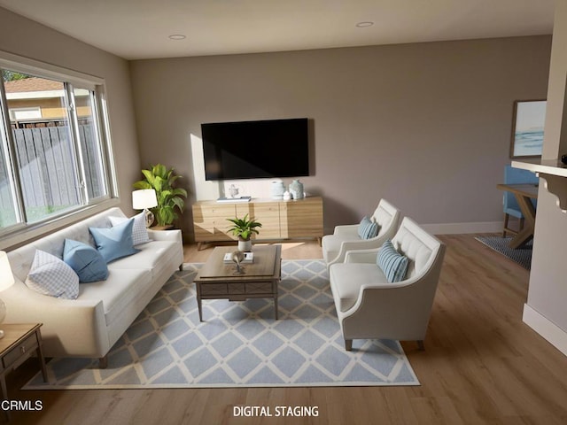 living room featuring plenty of natural light and hardwood / wood-style floors