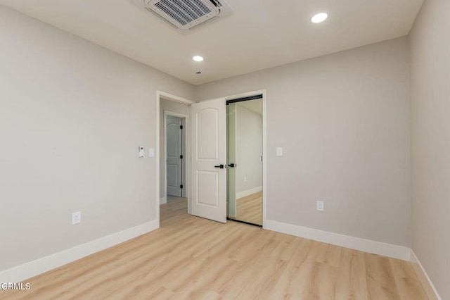 unfurnished bedroom with light hardwood / wood-style flooring