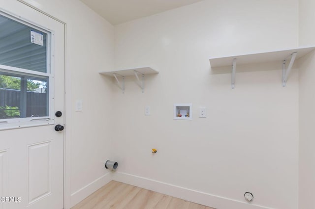 laundry room featuring light wood-type flooring, washer hookup, and gas dryer hookup