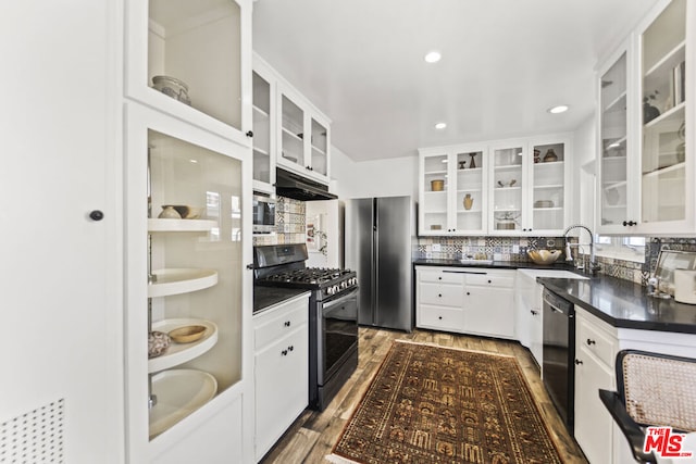 kitchen featuring black appliances, white cabinetry, tasteful backsplash, sink, and dark hardwood / wood-style floors