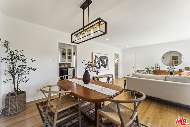 dining space featuring hardwood / wood-style floors